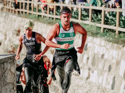Person moving fast during cardio workout outdoors